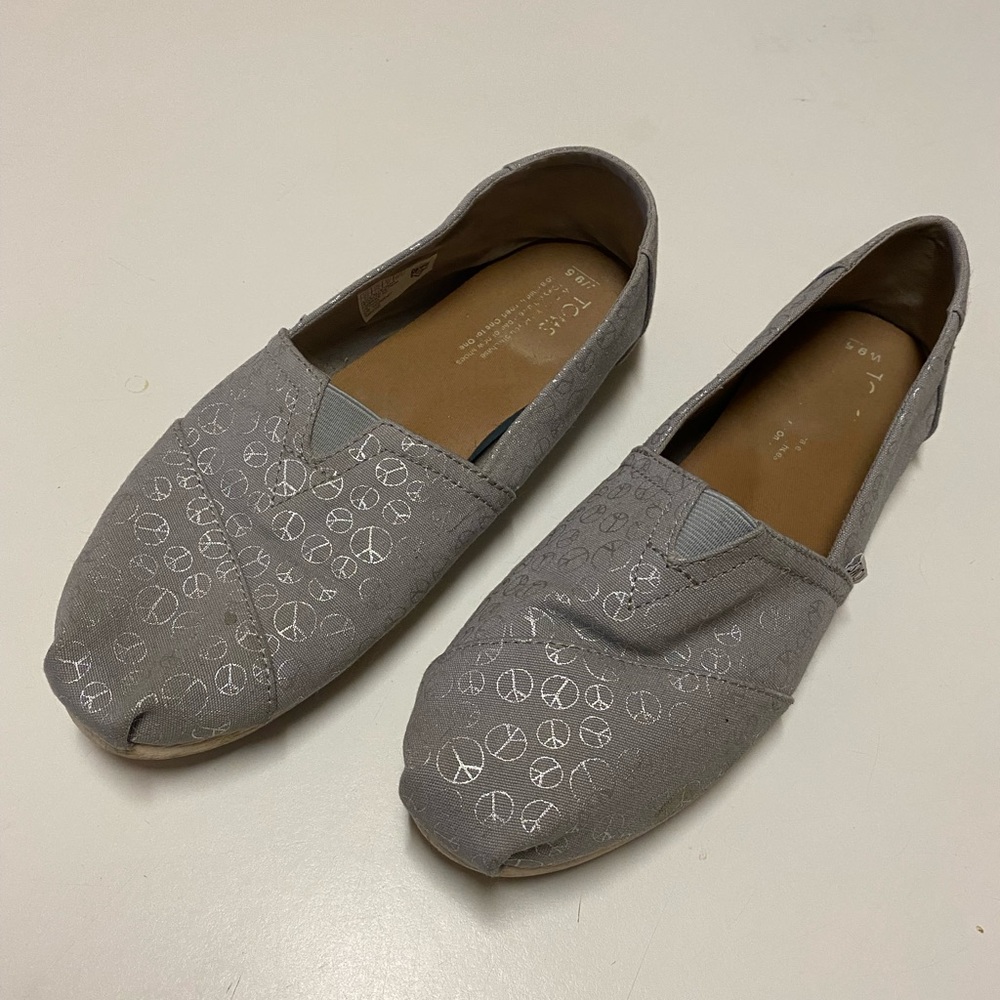 Metallic gray peace sign TOMS, size 9.5